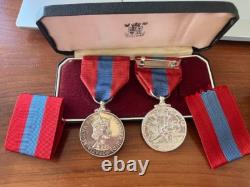 Pair of Imperial Service Silver Medals awarded for long service to Post Office