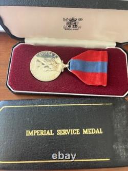 Pair of Imperial Service Silver Medals awarded for long service to Post Office