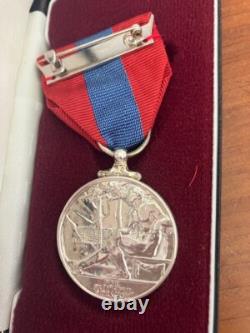 Pair of Imperial Service Silver Medals awarded for long service to Post Office