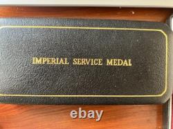 Pair of Imperial Service Silver Medals awarded for long service to Post Office